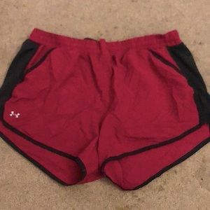 Under armor pink/red and black extra large women’s workout shorts.